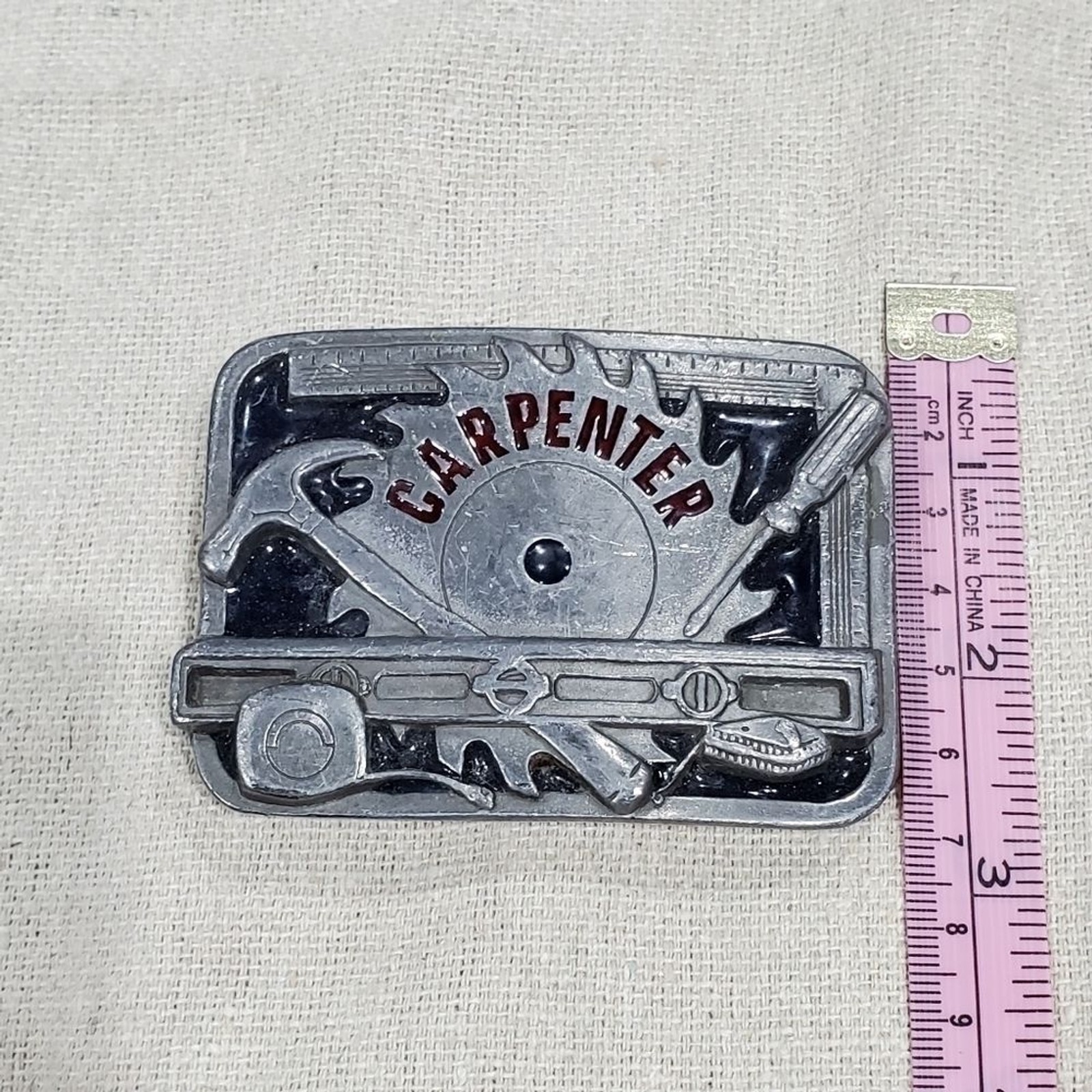 VINTAGE CARPENTER BELT BUCKLE SILVER METAL C&J INC 1994 COLLECTIBLE MENSWEAR DAD