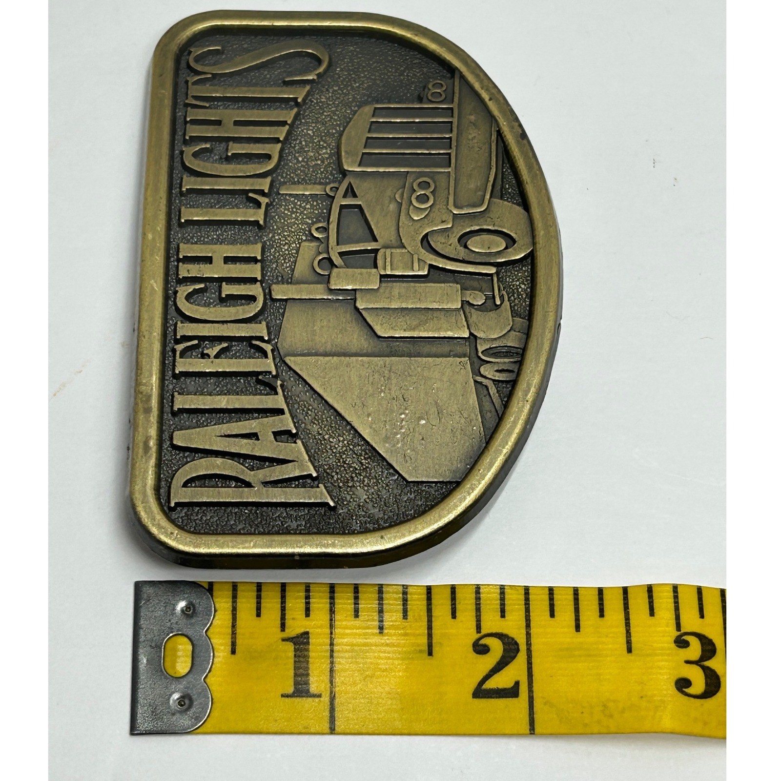 Vintage Raleigh Lights Semi Truck Belt Buckle Metal Antique Western Trucker