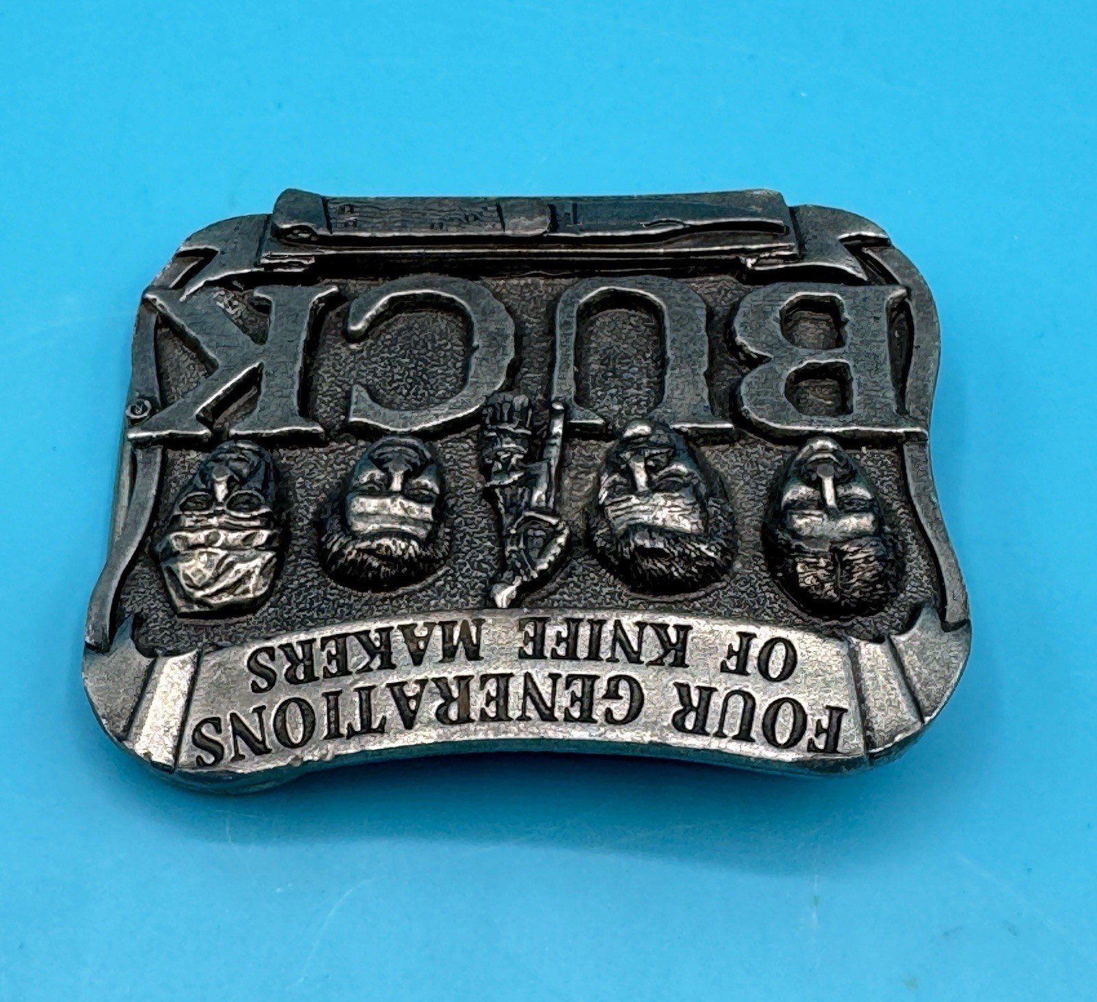 VINTAGE **FOUR GENERATIONS OF KNIFE MAKERS – BUCK KNIVES** BELT BUCKLE