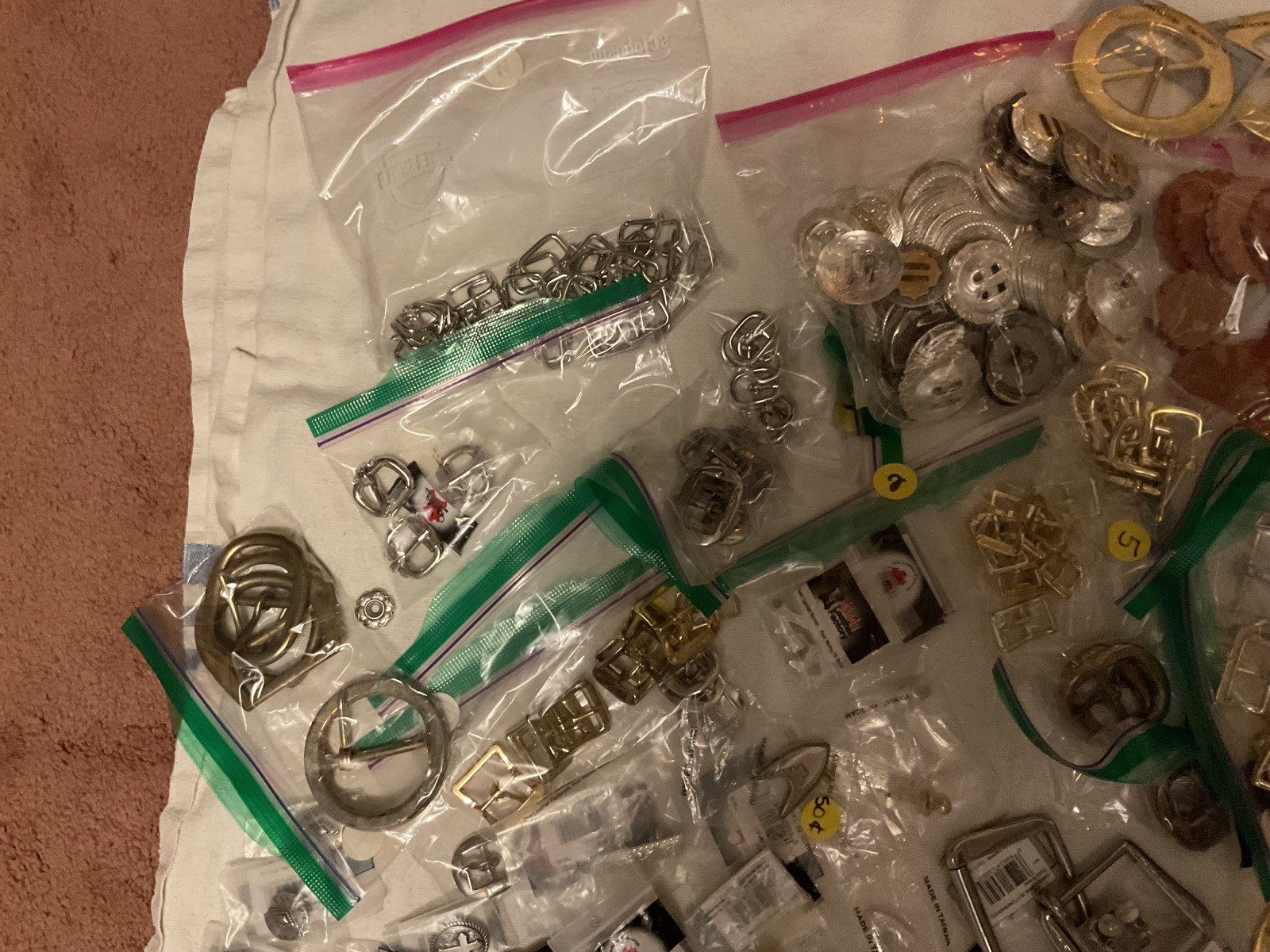 LOT OF 200 ITEMS: BUCKLES/ADDITIONAL ITEMS- VARIOUS STYLES AND DESIGNS – BOX 1