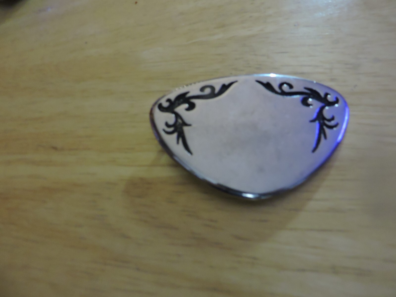 BELT BUCKLE SILVER WITH BLACK DESIGN TRIANGULAR SHAPE 3X2 INCHES