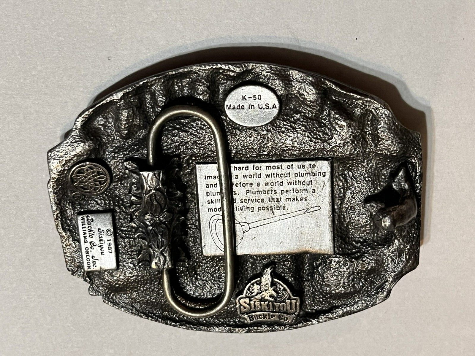 NICE PLUMBER BELT BUCKLE SOLID PEWTER WITH RED 1987 MADE IN USA SISKIYOU CO