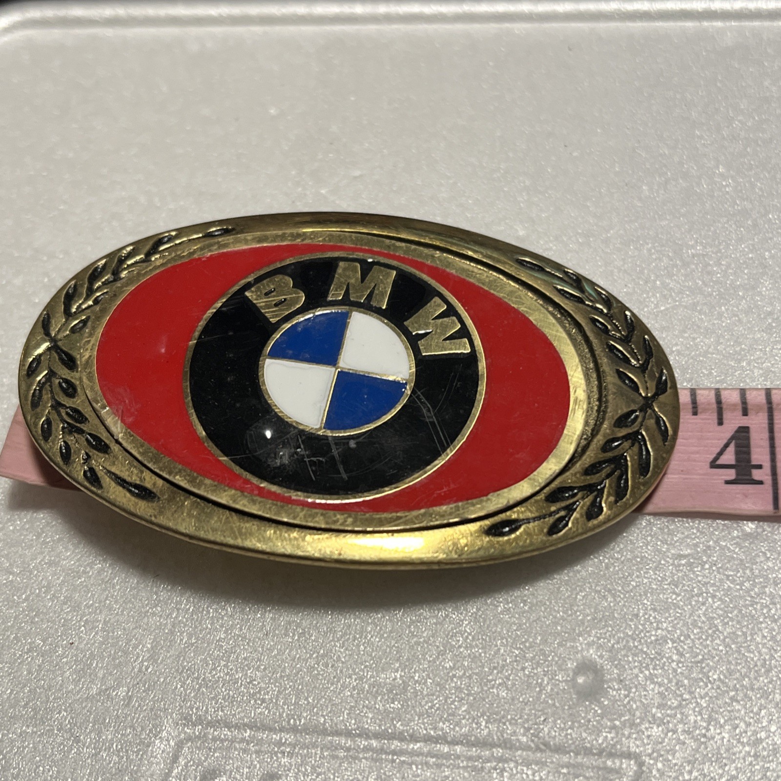 Vintage BMW Belt Buckle Brass Tone Red Enamel Logo Oval Laurel Wreath Automotive