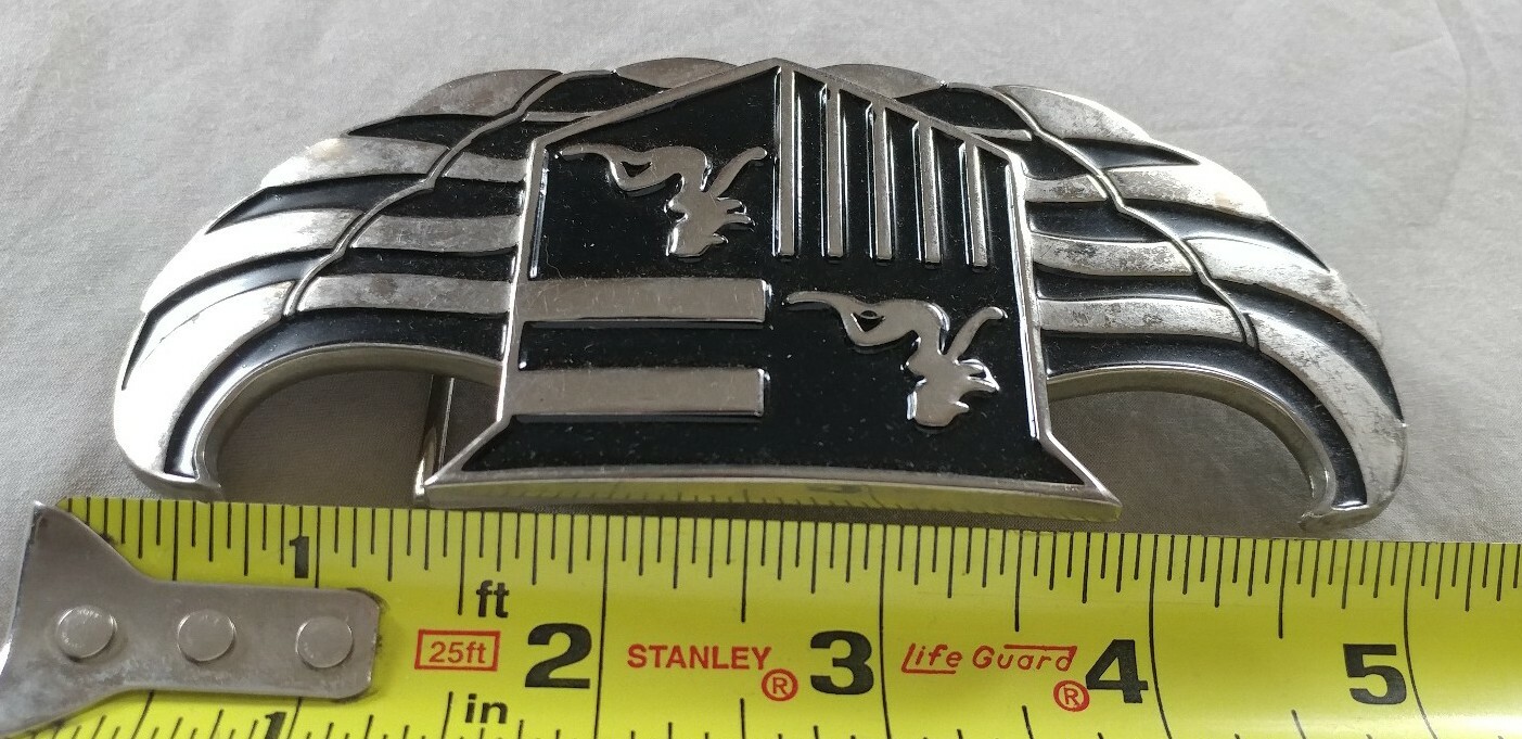 WINGS SHIELD MUD FLAP GIRL CREST BOTTLE OPENER BELT BUCKLE PRONG NEEDS REPAIR