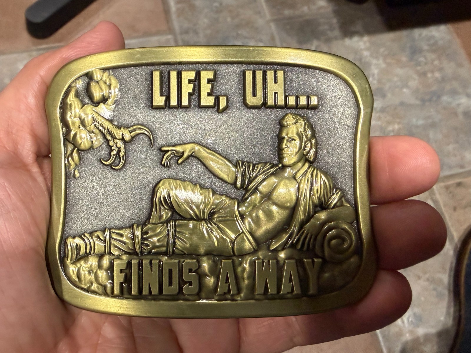 Jurassic Park Dr. Ian Malcom « Life Finds A Way » Belt Buckle