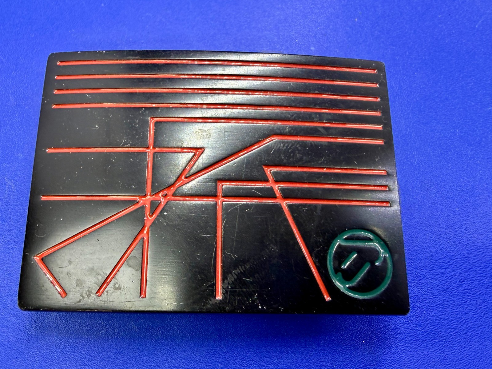 Unknown to me! Geometric Abstract Lines Red Over a Black Enamel Belt Buckle