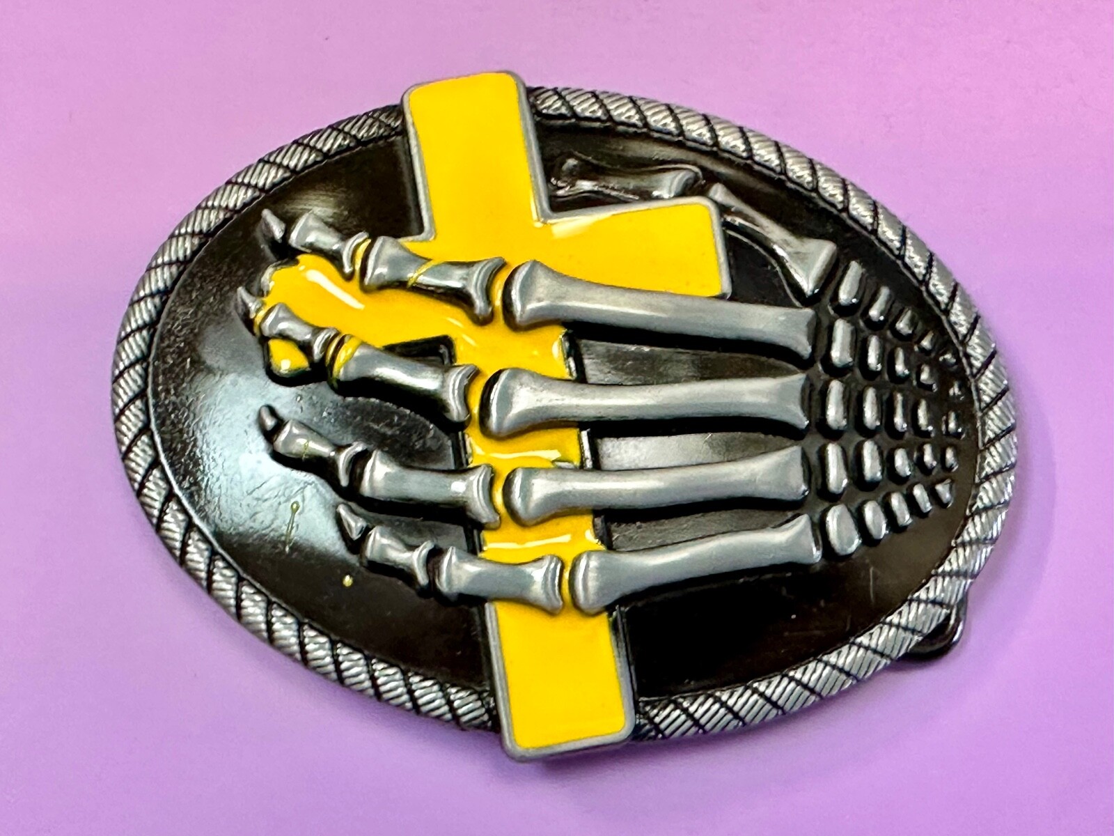 Skeleton Hand Holding Yellow Cross Vintage Dimensional Raised Belt Buckle