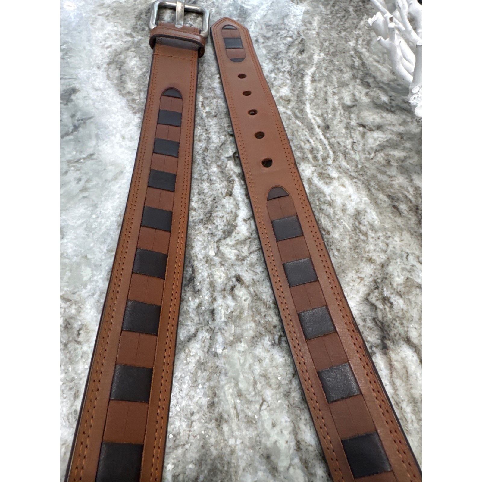 Men&rsquo;s brown leather belt featuring a prominent woven-inlay pattern size 44