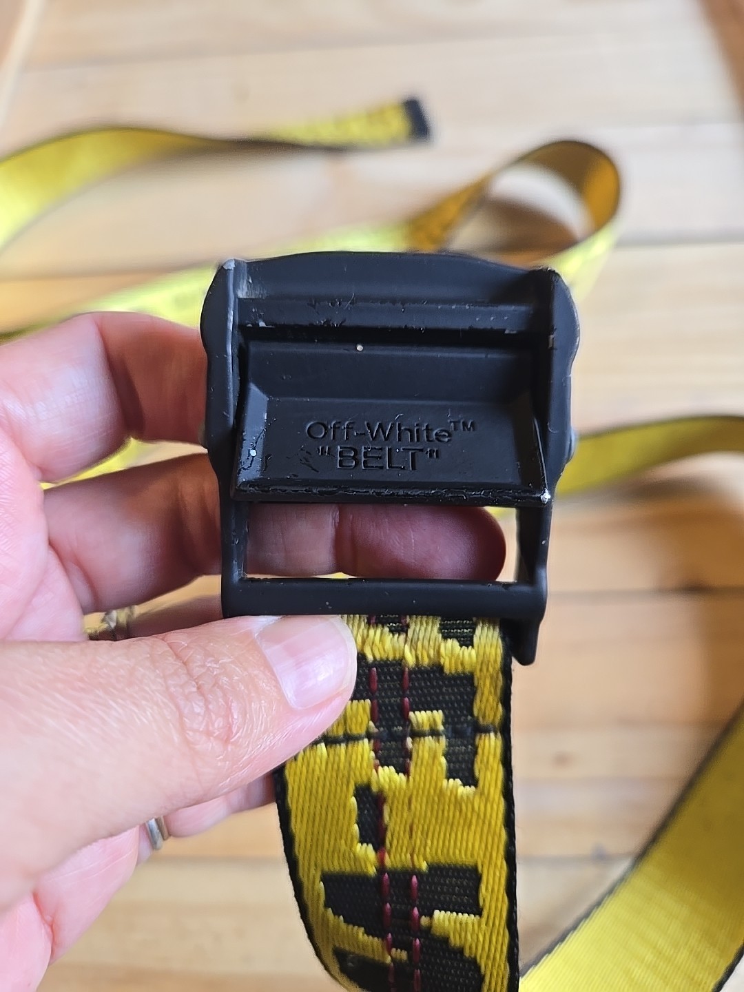 Off-White Industrial Belt in the yellow and black colorway, featuring a black…