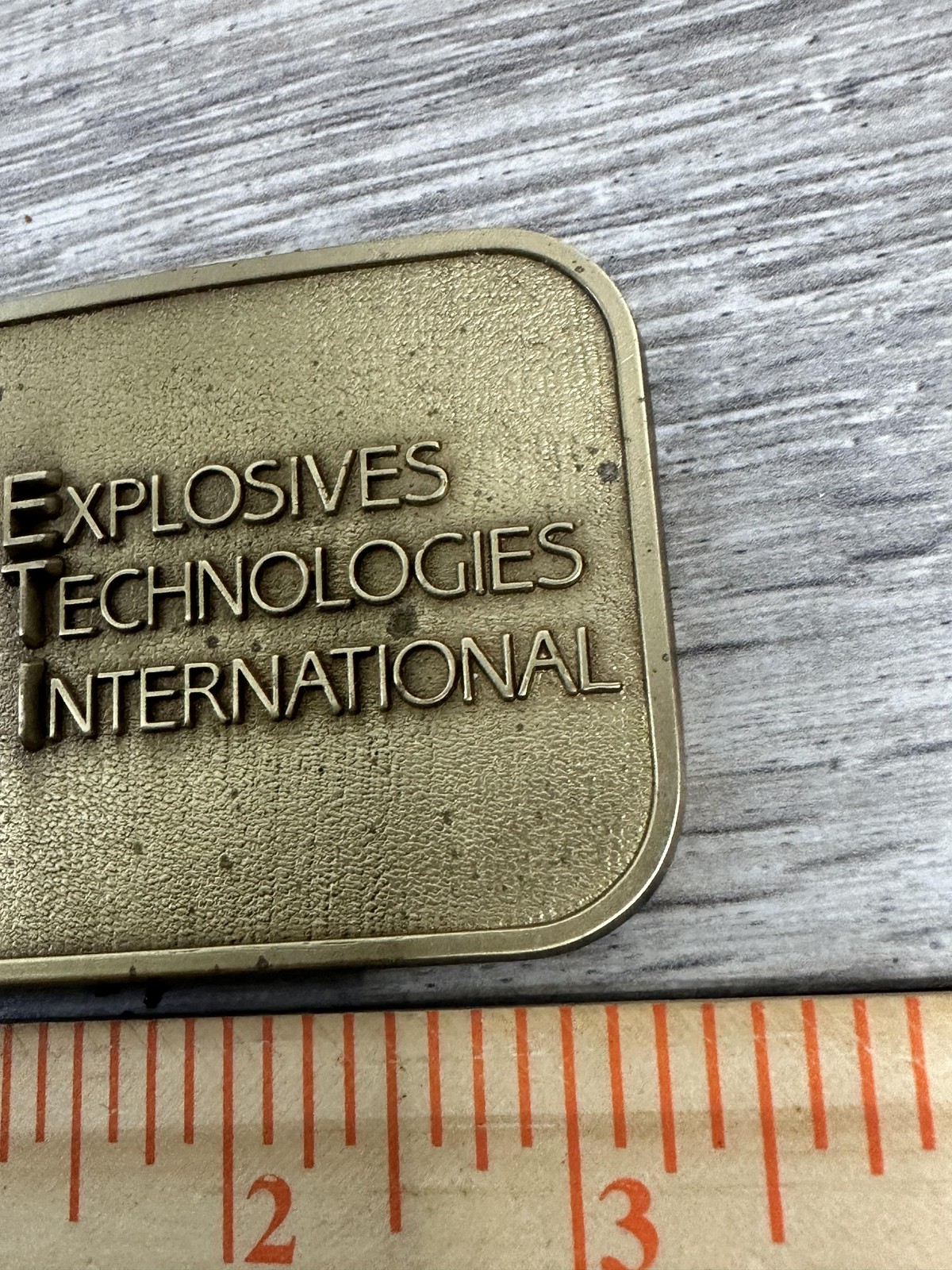 Explosives Technologies International ETI Belt Buckle Mens Brass Tone CD Hit