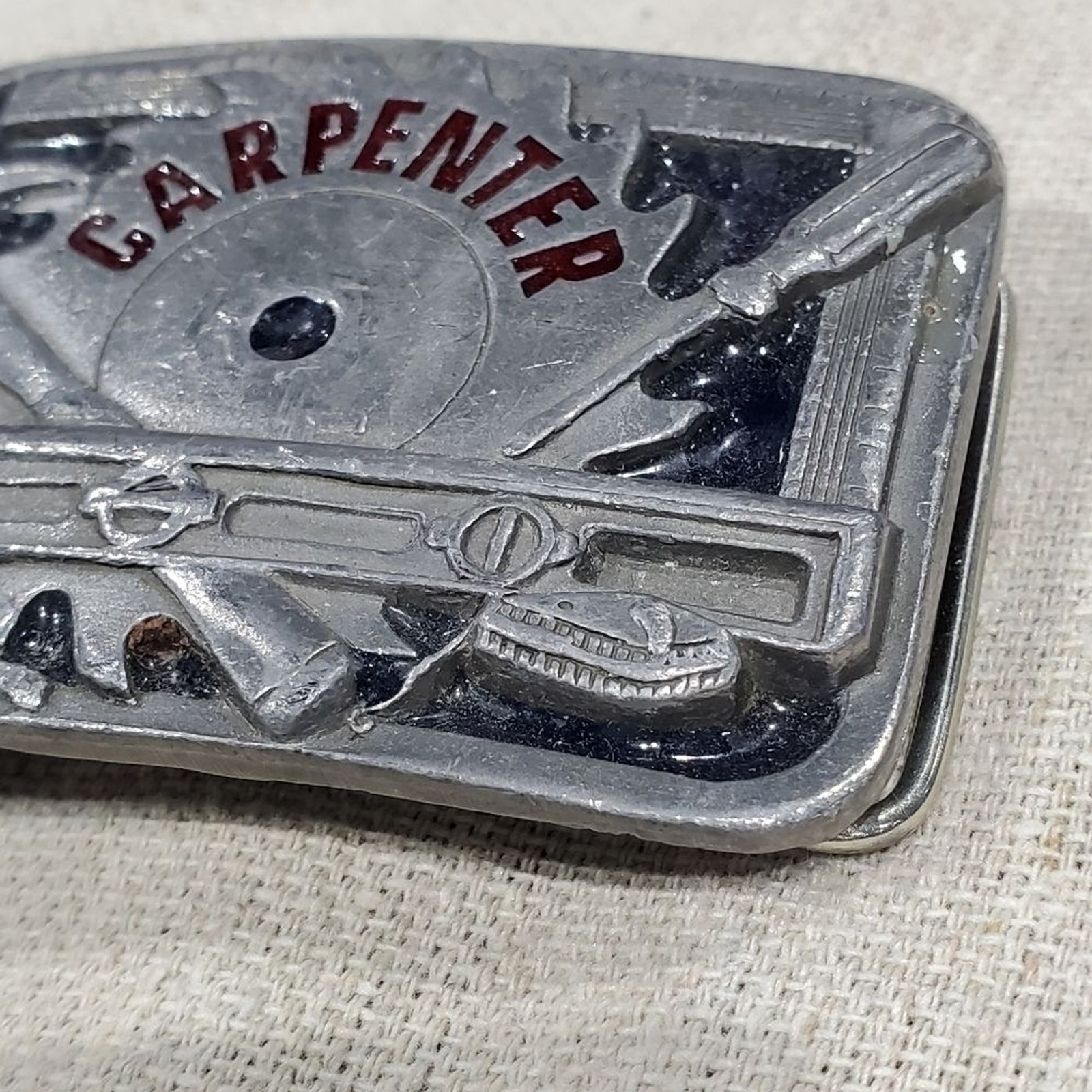 VINTAGE CARPENTER BELT BUCKLE SILVER METAL C&J INC 1994 COLLECTIBLE MENSWEAR DAD
