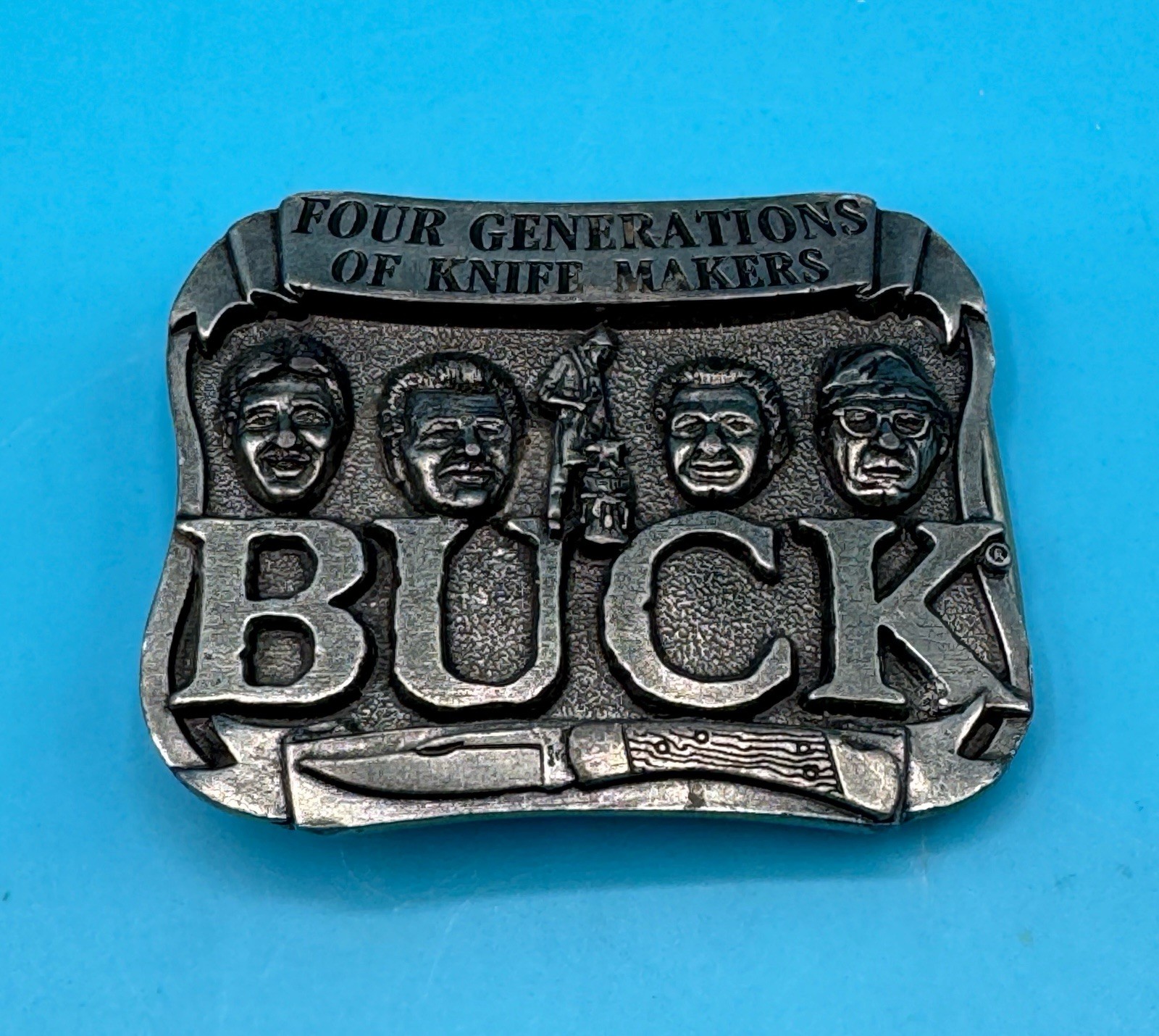 VINTAGE **FOUR GENERATIONS OF KNIFE MAKERS – BUCK KNIVES** BELT BUCKLE
