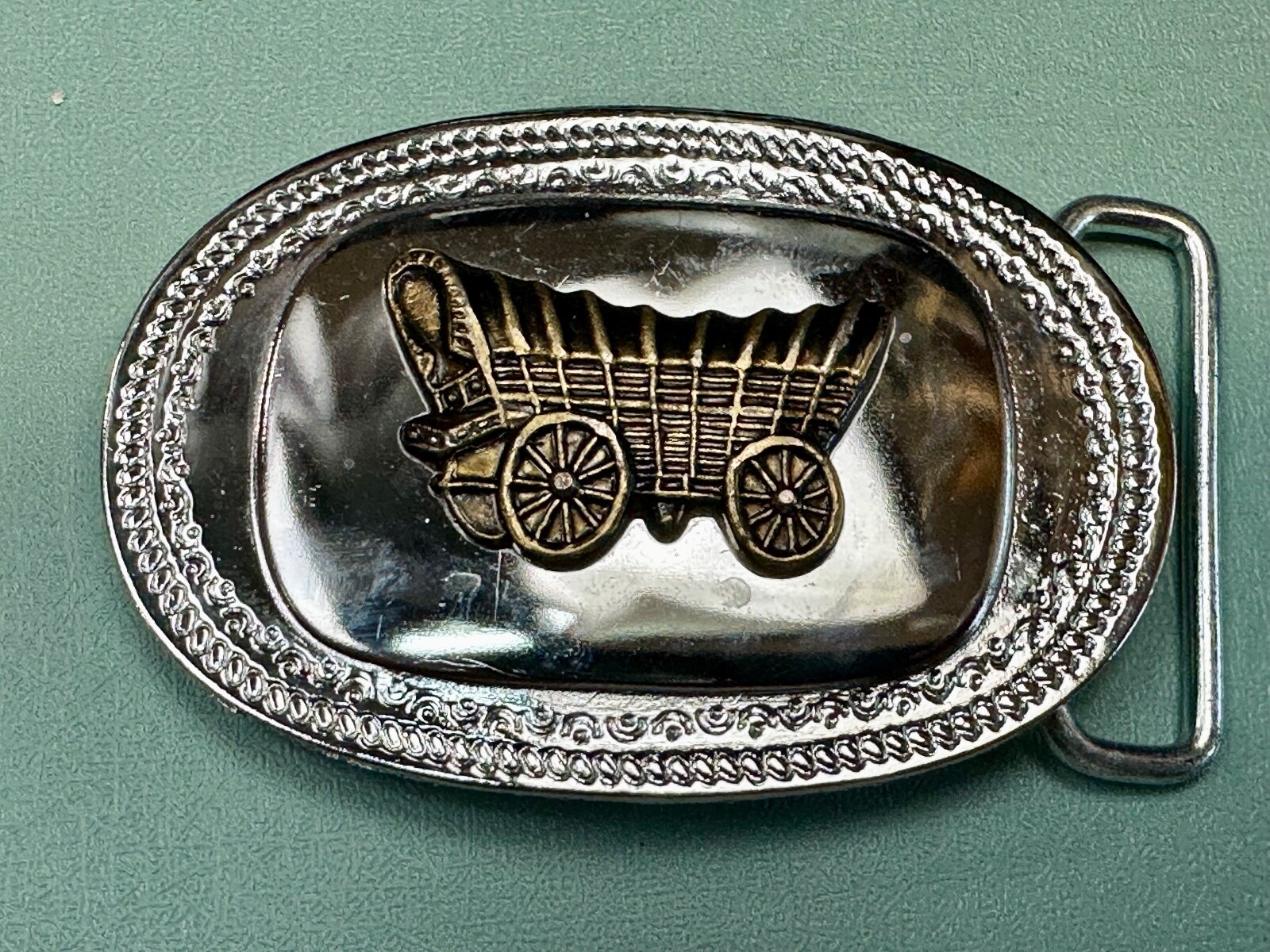Vintage Covered Wagon On Reflective Oval Two Tone Western Belt Buckle