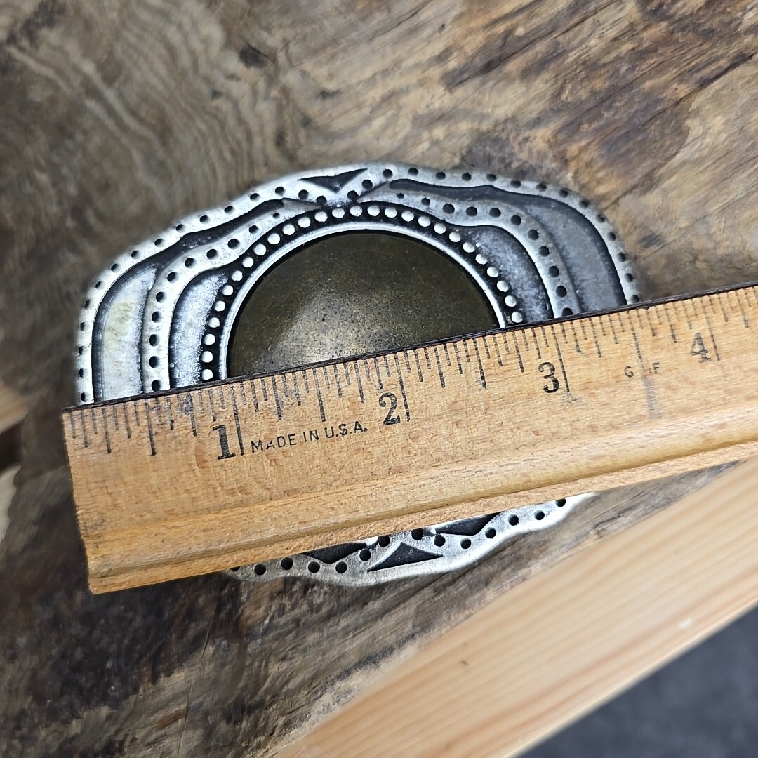 Unique vintage brass and steel belt buckle.