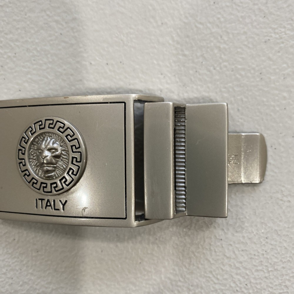 Belt Buckle Marked “Italy” Lion Face In Round, Scrolled Circle