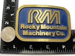 RM Rocky Mountain Machinery Co Blue & Gold Tone Belt Buckle Dynabuckle Utah