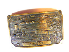 pre-owned brass « Silver City Mining Company Oregon » belt buckle w/ train scene