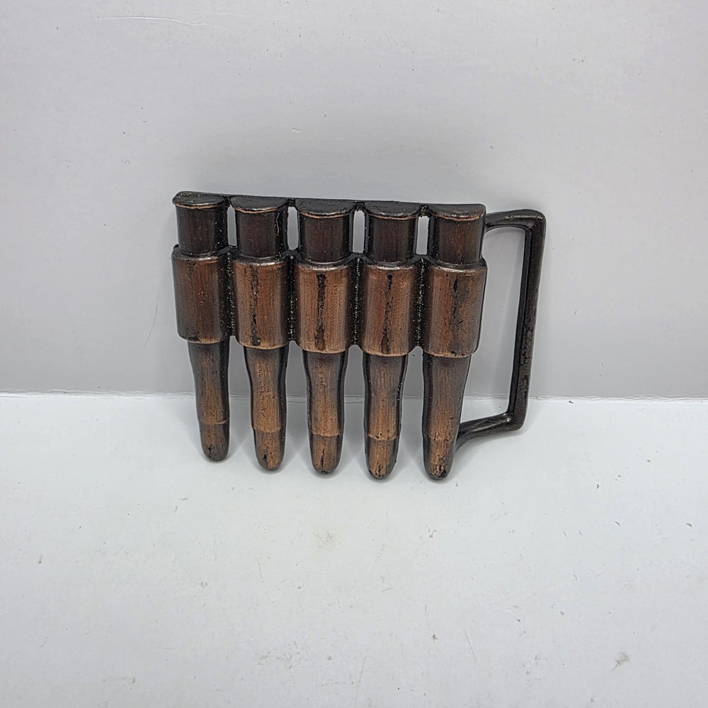 Vintage 1980&rsquo;s Metal bullet belt buckle copper tone gun ammunition. Hong Kong