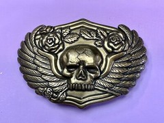 Dimensional Skull Head With Wings And Flowers – Raised Metal Belt Buckle