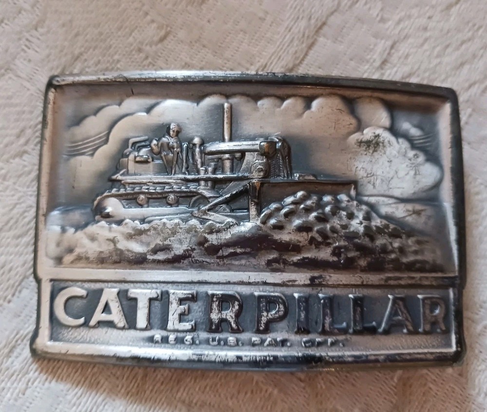 Neat Vintage Metal Caterpillar Tractors Belt Buckle w Farmer in Field 2×3&Prime; USA