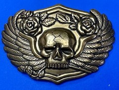 Dimensional Skull Head With Wings And Flowers – Raised Metal Belt Buckle