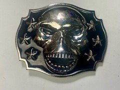 Raised Skull With Teeth Grin Black And Silver Color Belt Buckle Star Surround