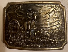 Belt Buckle With A Man And A Horse On It
