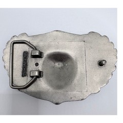 Silver-tone belt buckle featuring a skull with wings and roses