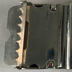 U.S. Navy belt buckle. “U.S.S. Algol AKA-54. Raised ship graphic.