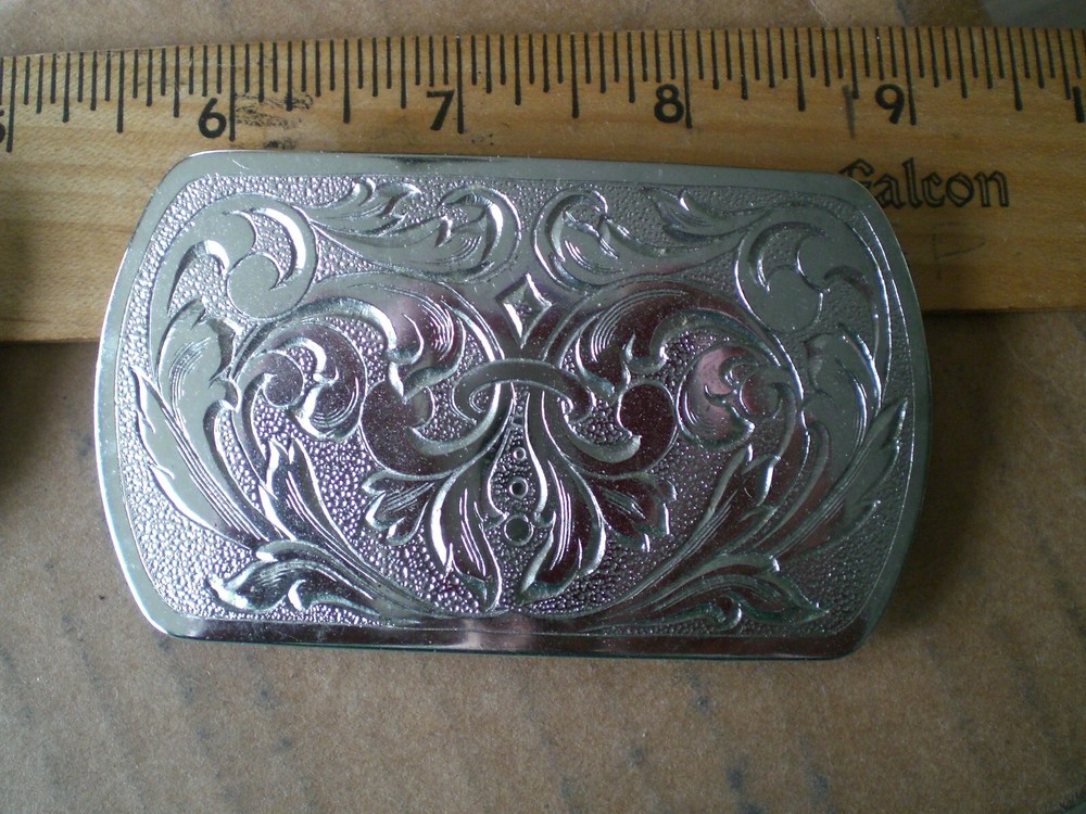2 silver tone shiny belt buckles