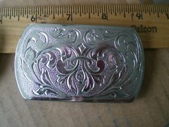 2 silver tone shiny belt buckles