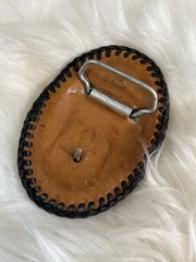 western-style leather belt buckle with a turquoise stone and rattlesnake skin