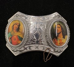Vintage silver toned belt buckle features oval portraits of Jesus and Mary RARE