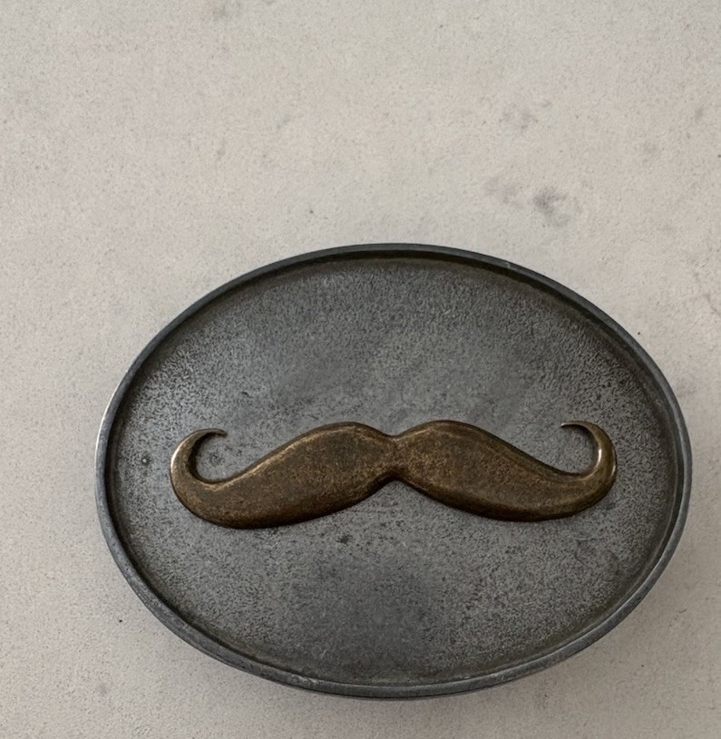BevBuckle mustache belt buckle designed to hold drinks hands-