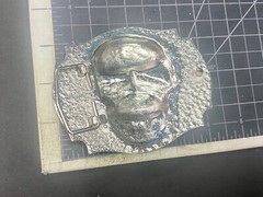 Raised Skull With Teeth Grin Black And Silver Color Belt Buckle Star Surround