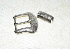 Pre-owned Belt Buckle, Silver in color. 2.5&Prime; x 2.5&Prime; Dated R 1999