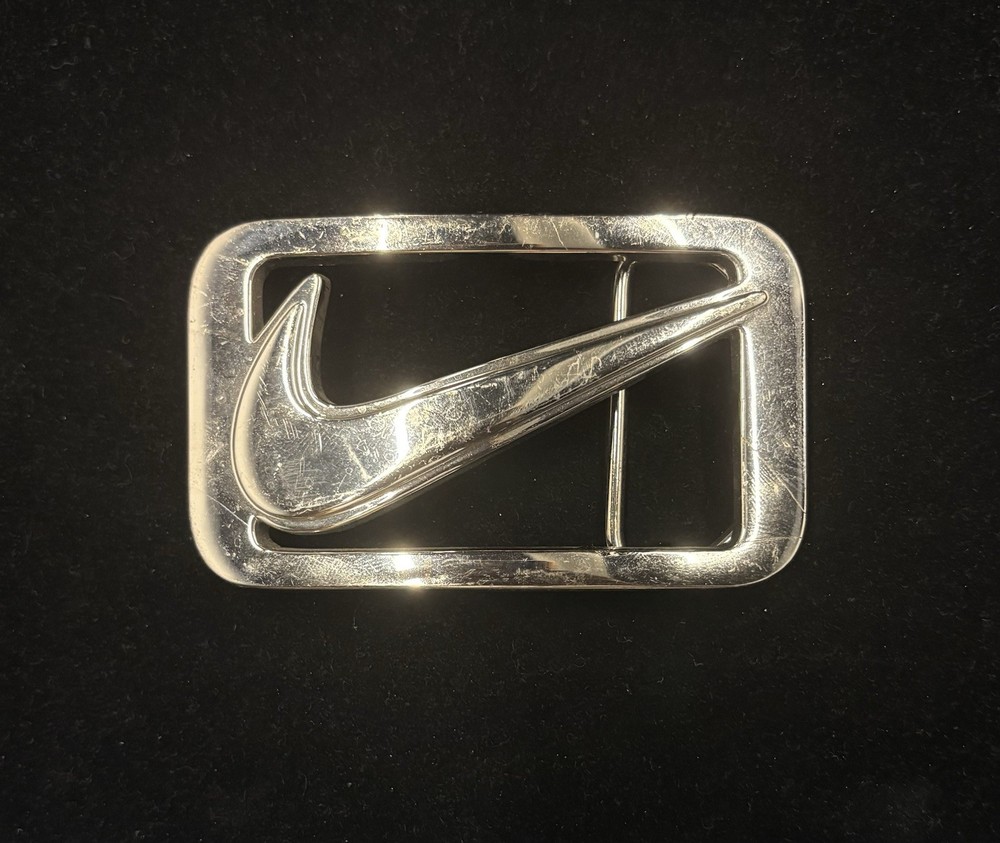 vintage Nike Y2K belt buckle features a polished metal construction RARE