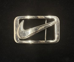 vintage Nike Y2K belt buckle features a polished metal construction RARE