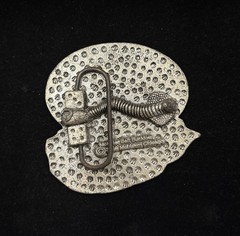 antique silver belt buckle depicts the head of Christ wearing a crown of thorns