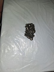 unbranded gothic belt buckle features a 3D pile of skulls and crossed bones…