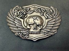 Dimensional Skull Head With Wings And Flowers – Raised Belt Buckle