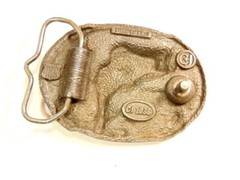 heavy older enameled buckle showing a leaping fish; CJ Inc., 1986, Made in USA