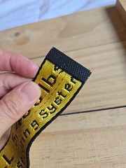 Off-White Industrial Belt in the yellow and black colorway, featuring a black…