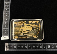 y2k punk Sex Pot Revenge belt buckle skull graphic on yellow background RARE