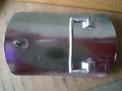 2 silver tone shiny belt buckles
