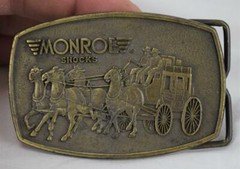 Vintage Monroe Shocks Stage Coach Belt Buckle