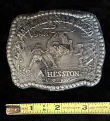 Hesston NFR 1996 Commemorative Belt Buckle New in Shrinkwrap Award Design Medals