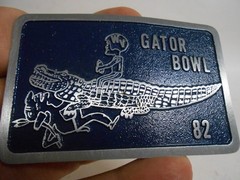1982 Gator Bowl Belt Buckle WVU Football Player on Gator Unworn–Free Ship