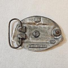 Belt Buckle – C+J Inc. 1990 Snowmobiler (with wear)