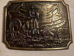 Belt Buckle With A Man And A Horse On It